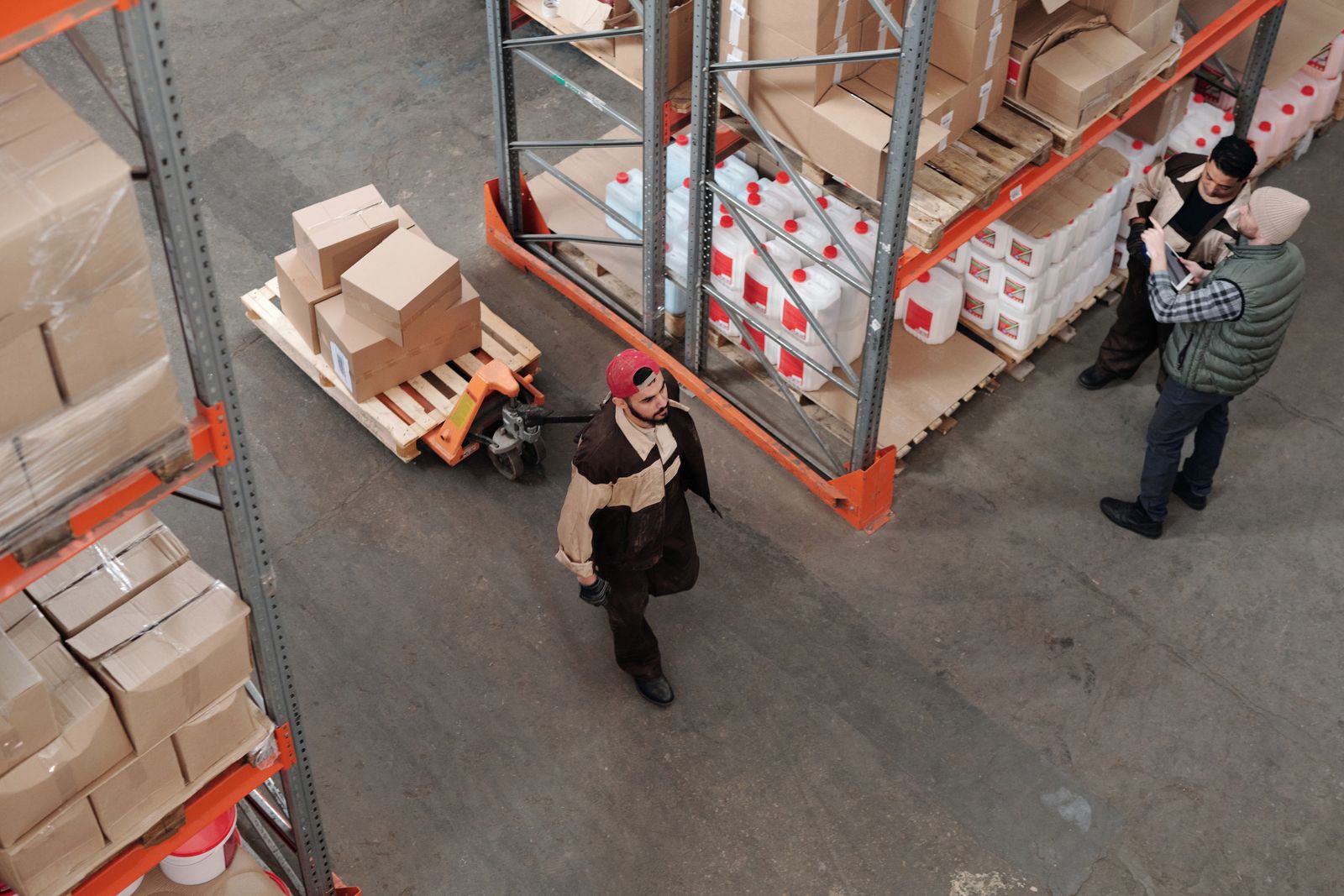 Logistics team coordinating shipments in a busy warehouse
